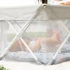 imageMy Play Baby Portable Infant Bassinet Indoor Outdoor UPF 50 Canopy Mesh Sides 29x14 Inches Foldable Travel Playard with Toys Padded Base Newborn to 15 Pounds